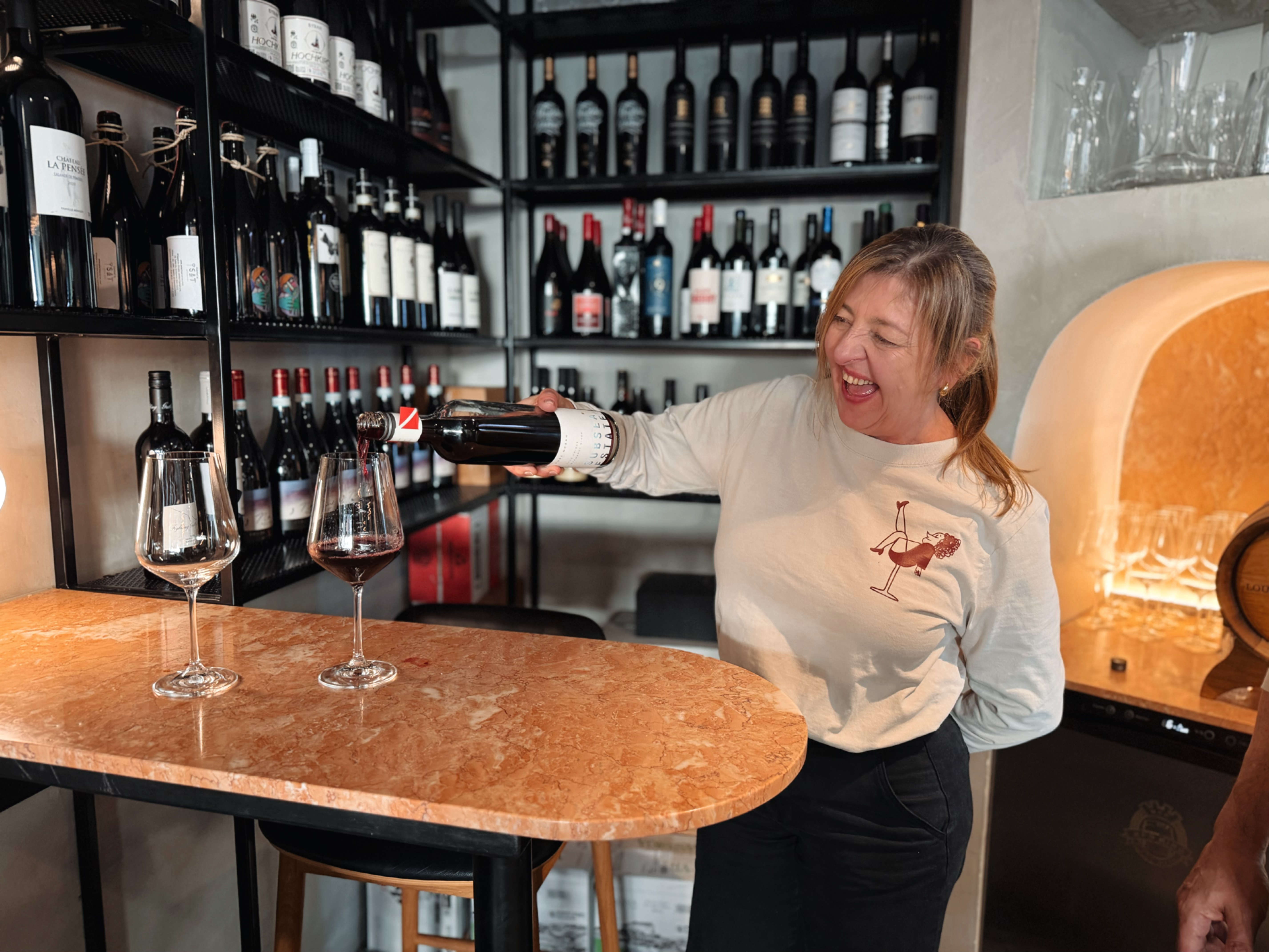 Silvana-Calil-Pouring-Subsea-Estate-Wild-Legs-Wine-Room-by-Lexie-Mamo.png